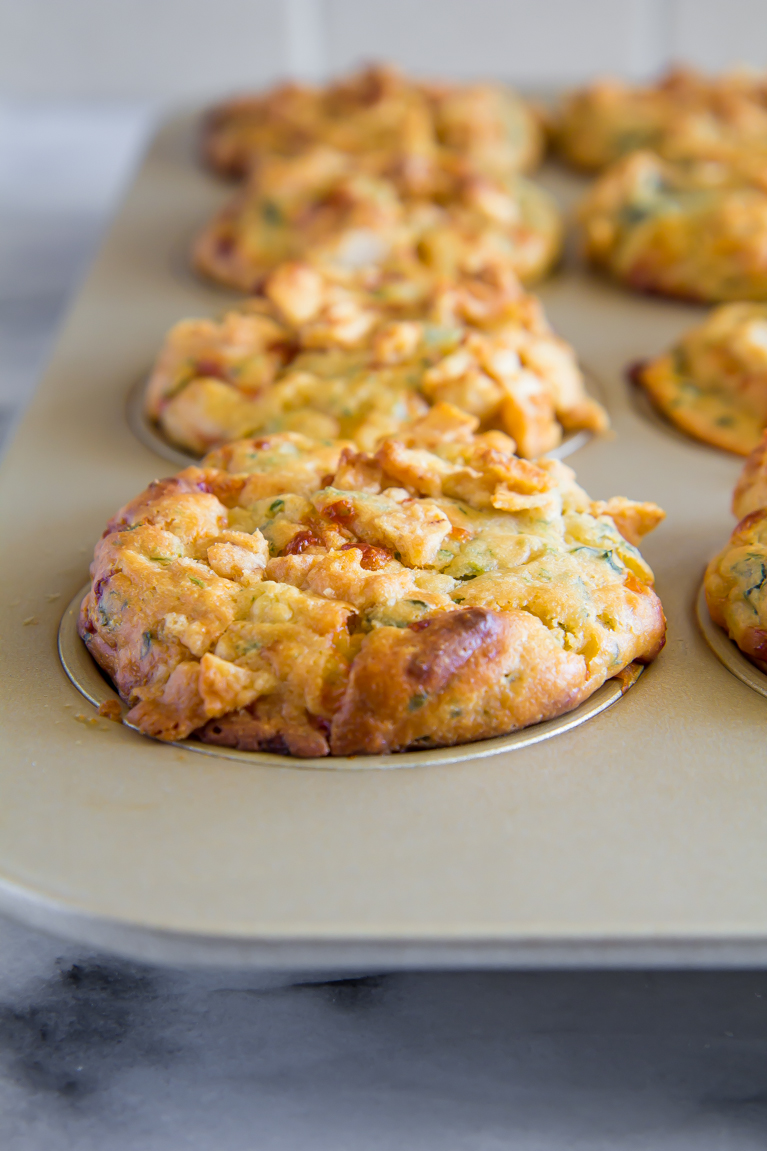 Spinach Artichoke Dip...made into MUFFINS! Complete with a pita chip streusel.  Perfect party appetizer!