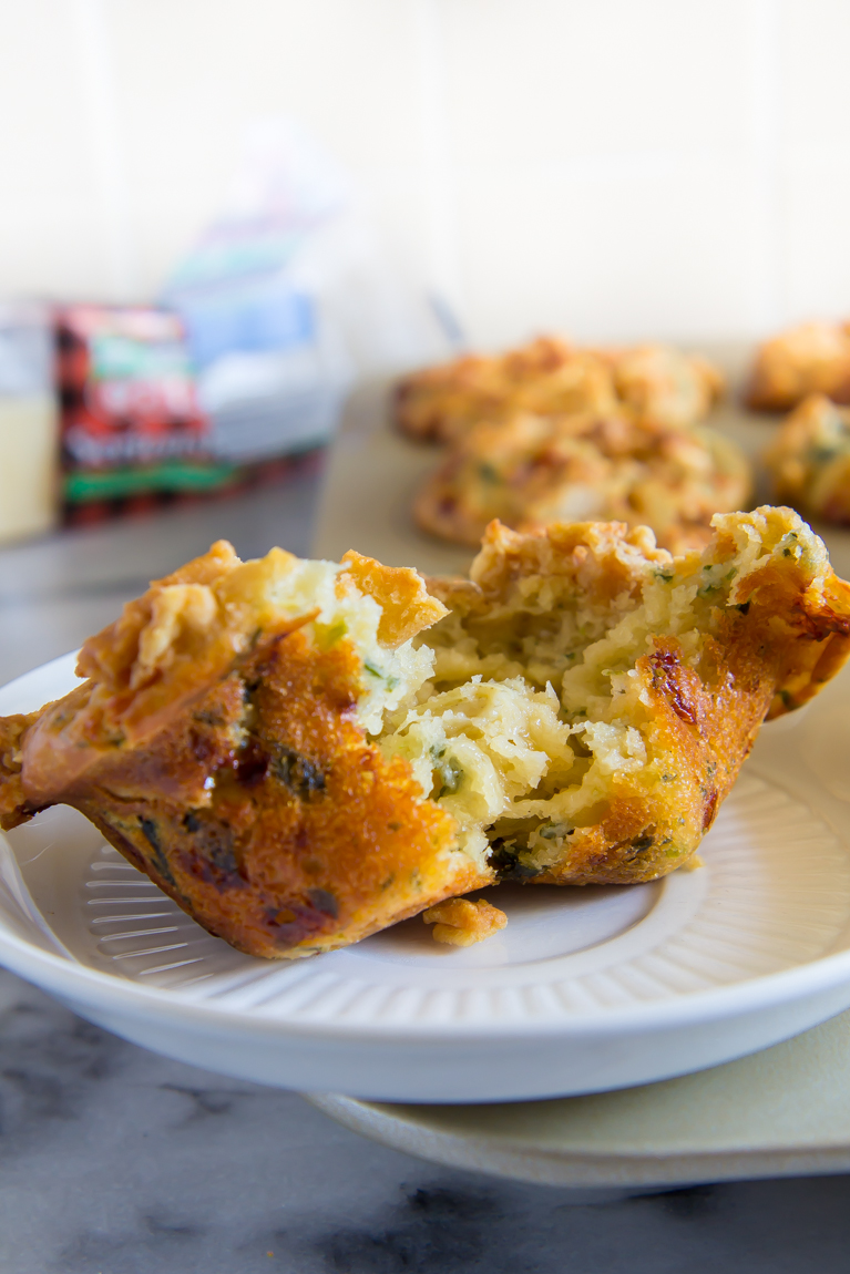Spinach Artichoke Dip...made into MUFFINS! Complete with a pita chip streusel.  Perfect party appetizer!