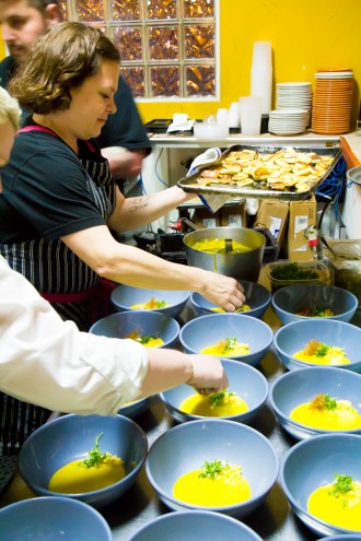 Chefs Rebecca Masson & Brandi Key prepping the Ricotta Gnocchi, Pickled Corn, Micro Basil, Saffron Broth \\ Aces of Taste